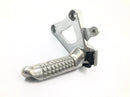 Suzuki GSX R 1100 GU74C [1987] - Footrest driver front left footrest bracket-1
